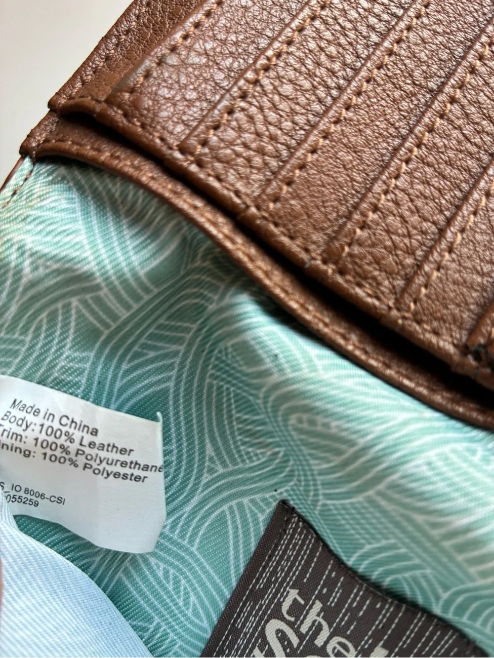 The Sak Tan Brown Embossed Floral Zip Wallet